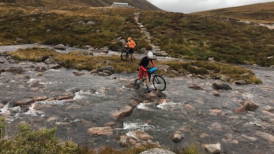 Two riders crossing the Ford of A'an in 2020.