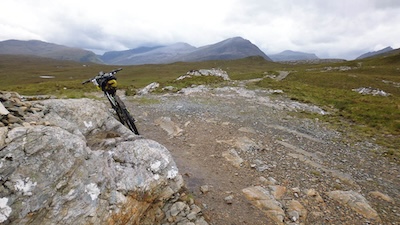 At the top of the Corrie Hallie climb. The Fisherfield hills ahead. The route eventually goes over the far skyline at the low point on the right.