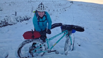 Cleaning mud, ice and snow off the bikes.