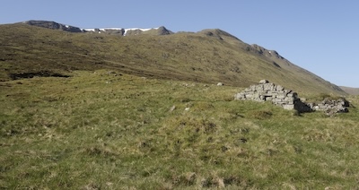 The old shieling near the watershed of the Allt Cam. The cliffs of Geal Charn above.
